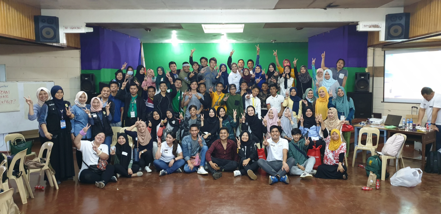 Marawi youths participating in a team-building exercise to foster unity and rebuild social ties.