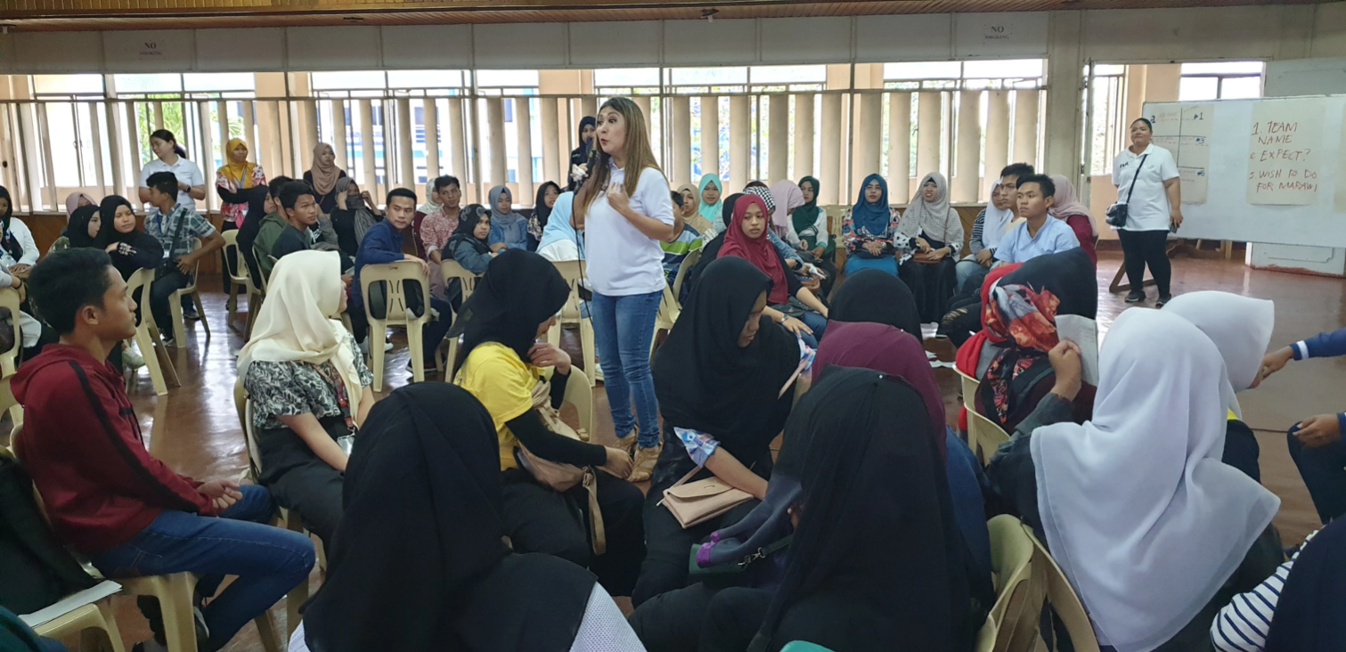 TrainStation International team standing with local Marawi partners dedicated to long-term community recovery.