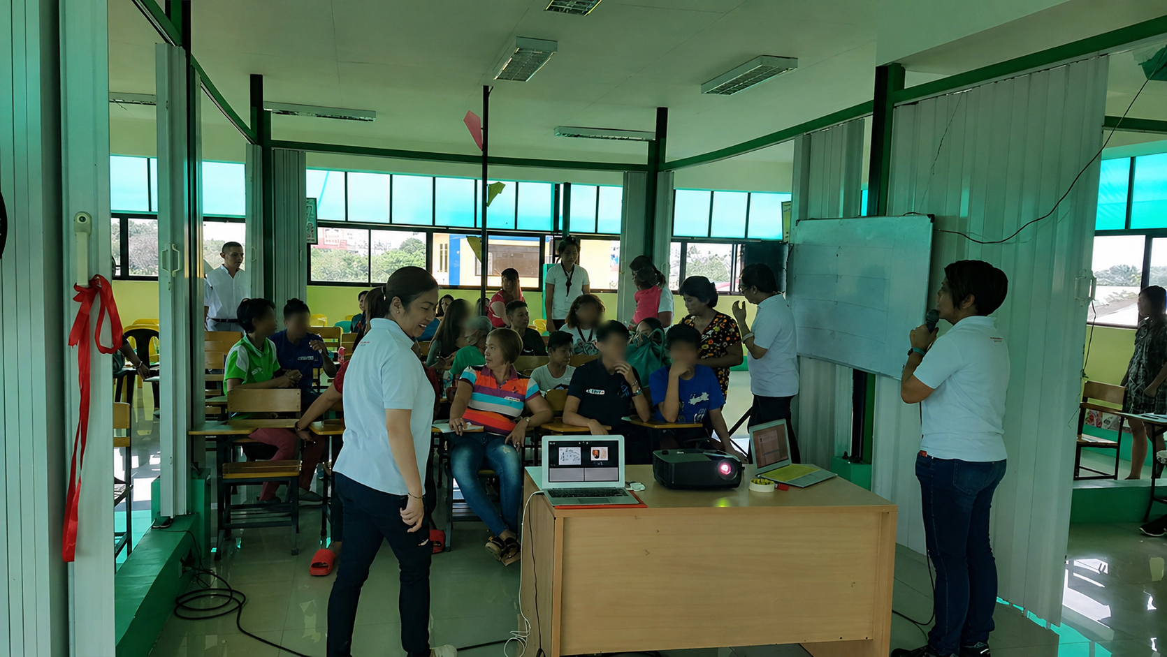 TrainStation coaches training local facilitators to lead ongoing 'Usap Tayo' support circles independently.